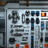 Industrial spare parts laid out on table